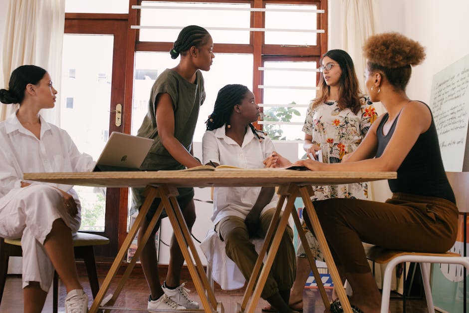 Colombian professionals discussing movement tips in modern office