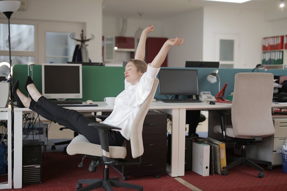 Office worker stretching arms in Colombian workplace
